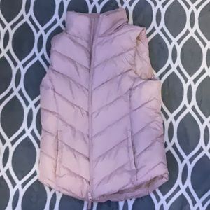 This pink vest is light pink and it is a very nice texture